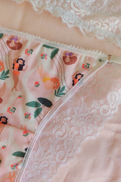 Detalle tela estampa Qué Tupé y puntilla posterior vedetina Encanto Diosas – Qué Tupé